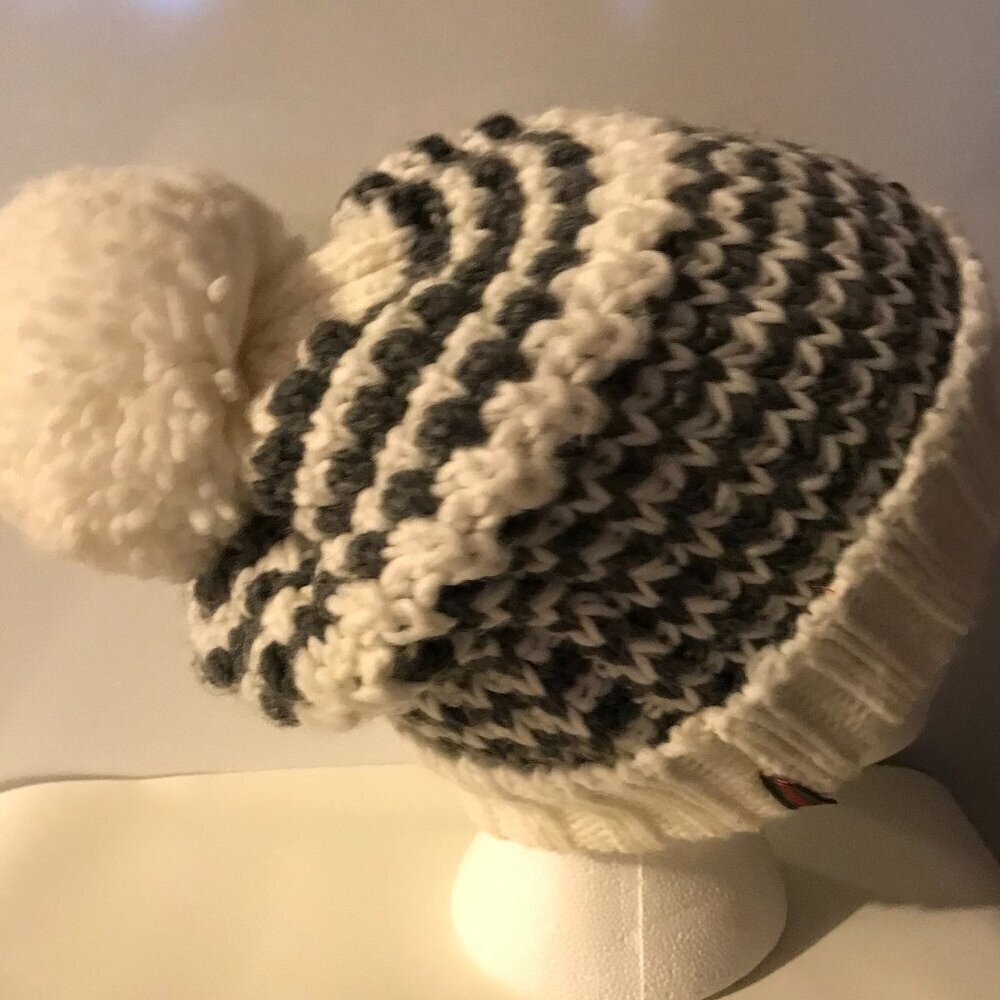 Buff beanie stocking cap/hat.  Gray & white.  With Pom on top.  Primaloft